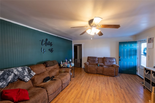 living room featuring ceiling fan and light hardwood / wood-style flooring