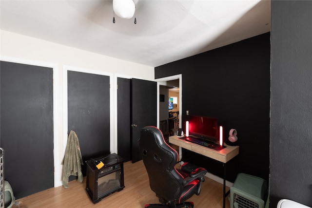 office area with light hardwood / wood-style floors