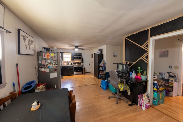 office featuring ceiling fan and light hardwood / wood-style flooring