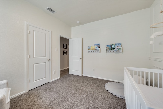 bedroom featuring carpet floors and a crib