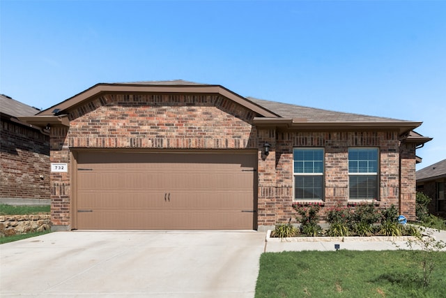 ranch-style home featuring a garage