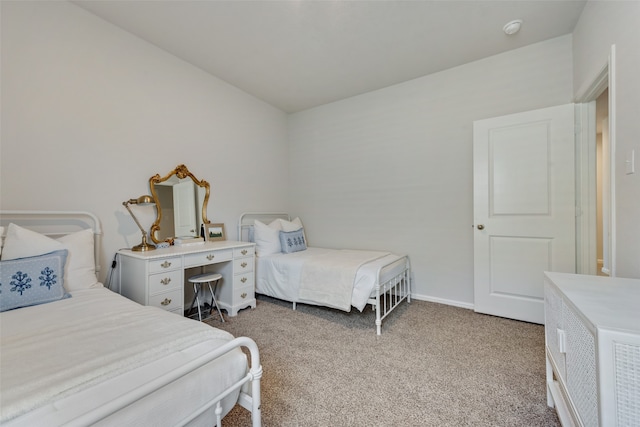 bedroom featuring light colored carpet