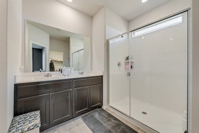 bathroom with vanity, hardwood / wood-style flooring, and walk in shower