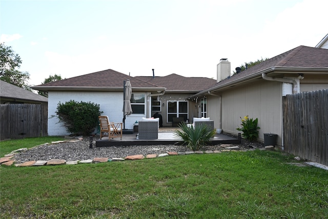 back of house with a patio and a yard