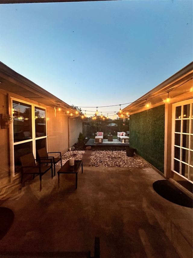 view of patio terrace at dusk