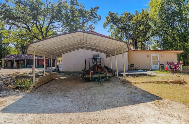 view of parking / parking lot with a carport