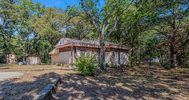 exterior space with a storage shed