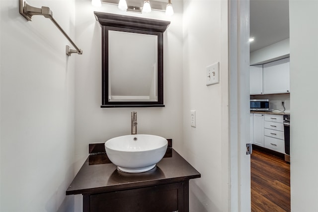 bathroom with vanity and wood-type flooring