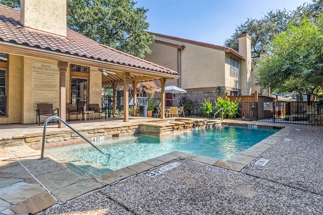 view of pool featuring a patio area and ceiling fan