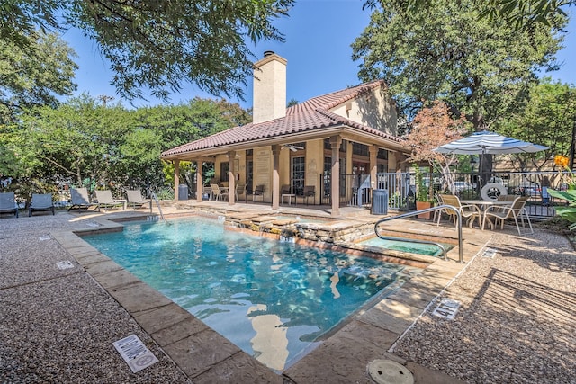 view of pool with a community hot tub, a patio, and ceiling fan