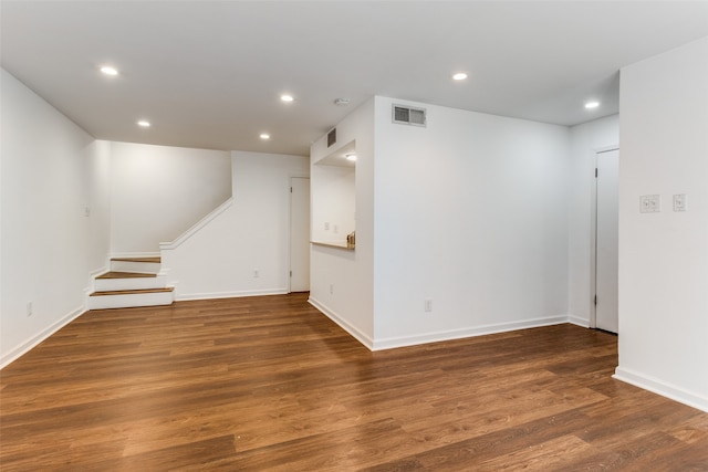 unfurnished room featuring dark hardwood / wood-style flooring