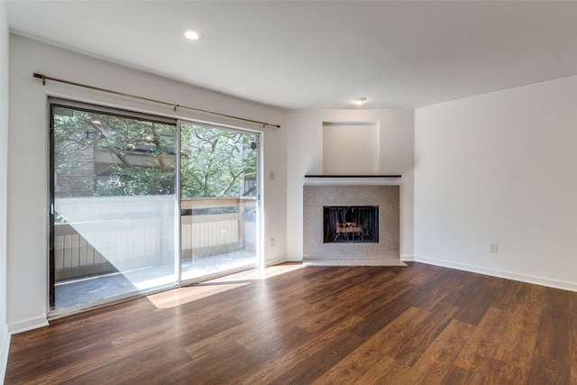 unfurnished living room featuring dark wood-type flooring