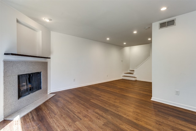 unfurnished living room featuring dark hardwood / wood-style flooring