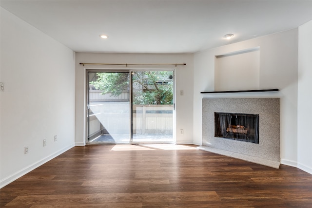 unfurnished living room with dark hardwood / wood-style floors