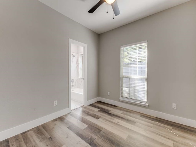 unfurnished room featuring ceiling fan and light wood-type flooring