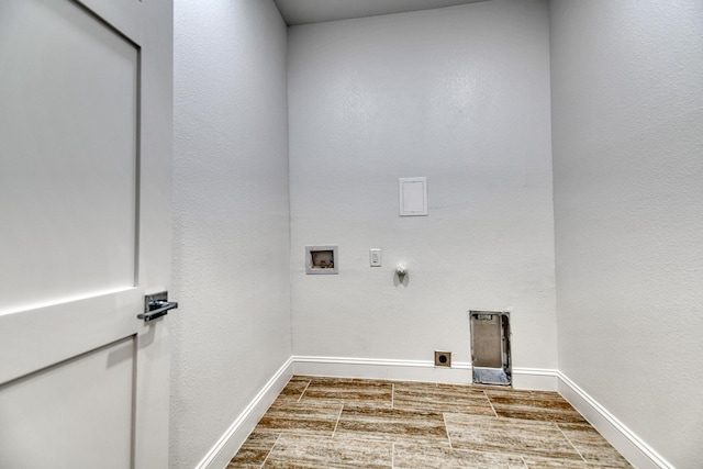 washroom with hookup for an electric dryer, laundry area, hookup for a gas dryer, baseboards, and hookup for a washing machine