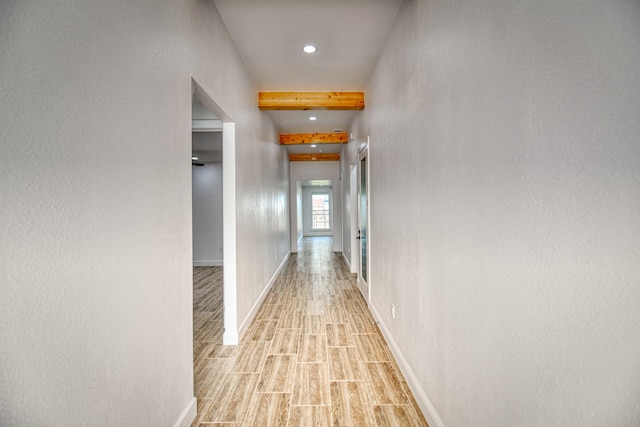 hallway with light hardwood / wood-style flooring