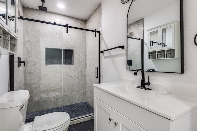 bathroom with a shower with door, toilet, tile patterned flooring, and vanity