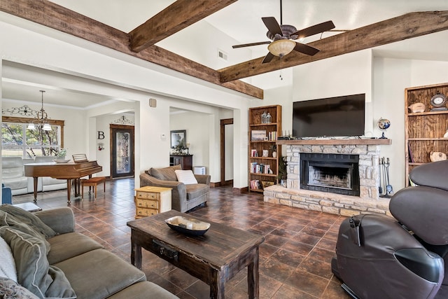 living room featuring a stone fireplace, dark tile patterned flooring, beam ceiling, and ceiling fan