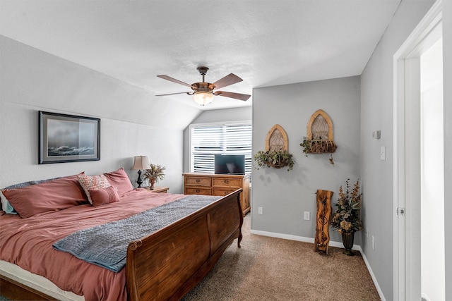 carpeted bedroom featuring ceiling fan, a textured ceiling, and lofted ceiling