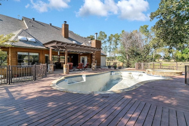 view of swimming pool featuring a deck and an outdoor hot tub