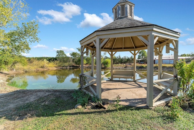 view of dock with a water view and a gazebo