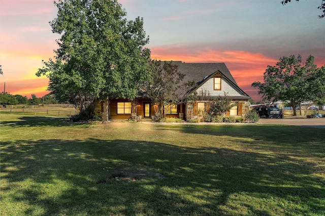 view of front of home with a lawn