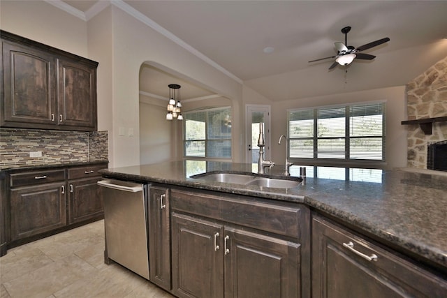 4095 Bridgecreek Dr, Rockwall, TX 75032 - kitchen featuring a sink, dark brown cabinetry, decorative backsplash, ceiling fan, and dishwasher