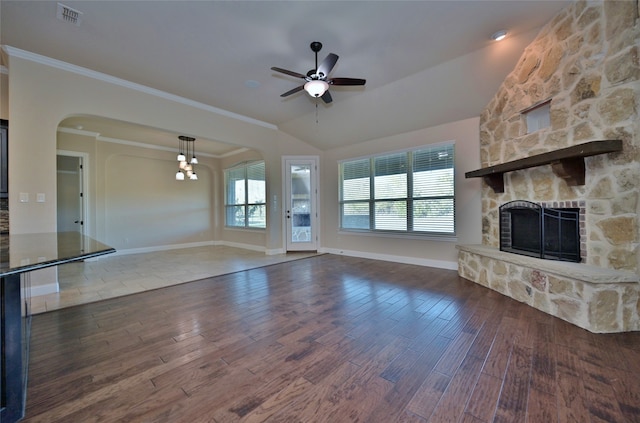 unfurnished living room featuring hardwood / wood-style flooring, ornamental molding, lofted ceiling, and a fireplace