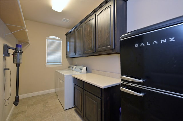 4095 Bridgecreek Dr, Rockwall, TX 75032 - laundry area with baseboards, visible vents, independent washer and dryer, cabinet space, and light tile patterned floors