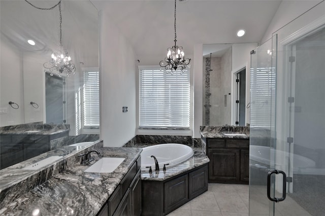 4095 Bridgecreek Dr, Rockwall, TX 75032 - bathroom with vaulted ceiling, a garden tub, a sink, and an inviting chandelier
