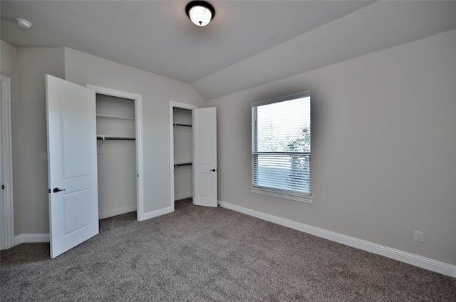 4095 Bridgecreek Dr, Rockwall, TX 75032 - unfurnished bedroom with vaulted ceiling, multiple closets, carpet flooring, and baseboards