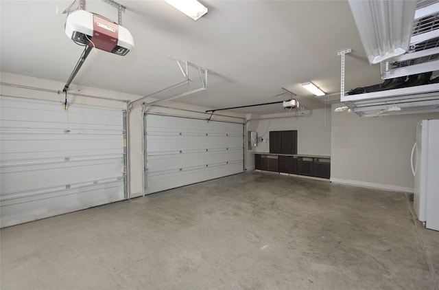 garage featuring a garage door opener and white fridge