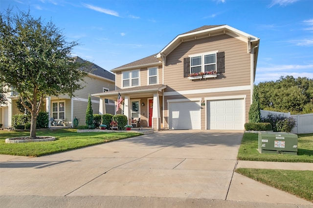 view of front of property with a front yard and a garage