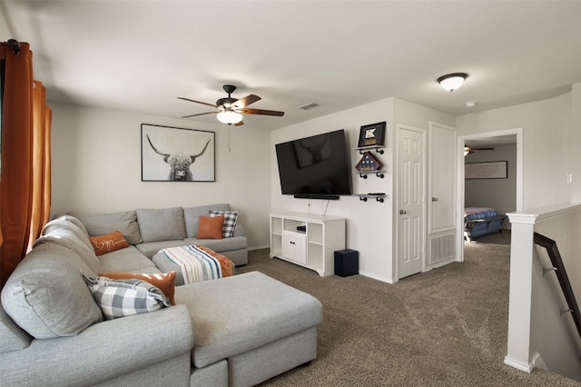 carpeted living room featuring ceiling fan