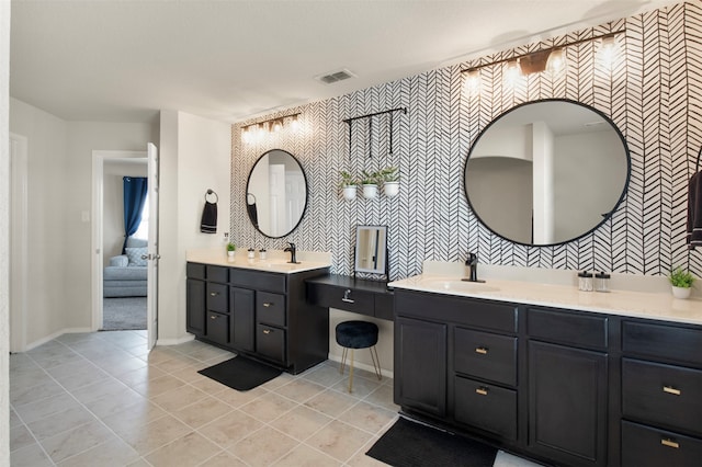 bathroom with vanity and tile patterned flooring