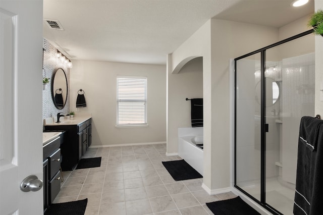 bathroom featuring vanity, shower with separate bathtub, and tile patterned floors