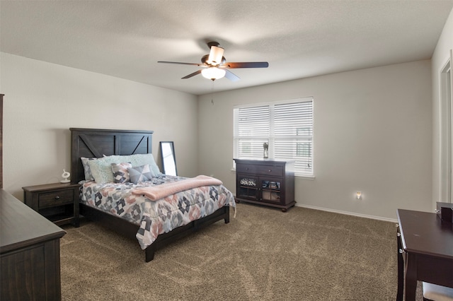 carpeted bedroom with a textured ceiling and ceiling fan