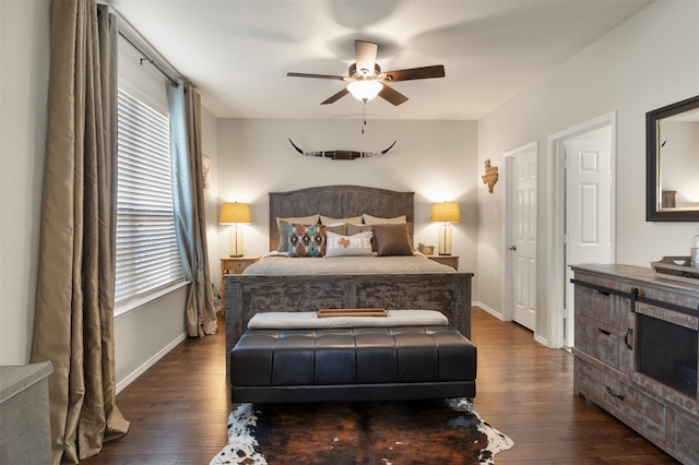 bedroom featuring dark hardwood / wood-style floors and ceiling fan