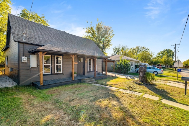 bungalow featuring a front yard and a porch