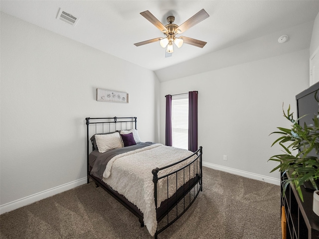 carpeted bedroom featuring a ceiling fan, vaulted ceiling, baseboards, and visible vents