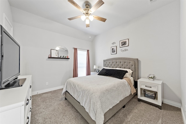 bedroom featuring ceiling fan, light colored carpet, and lofted ceiling