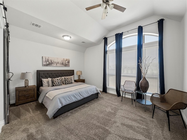 carpeted bedroom with lofted ceiling, multiple windows, baseboards, and visible vents