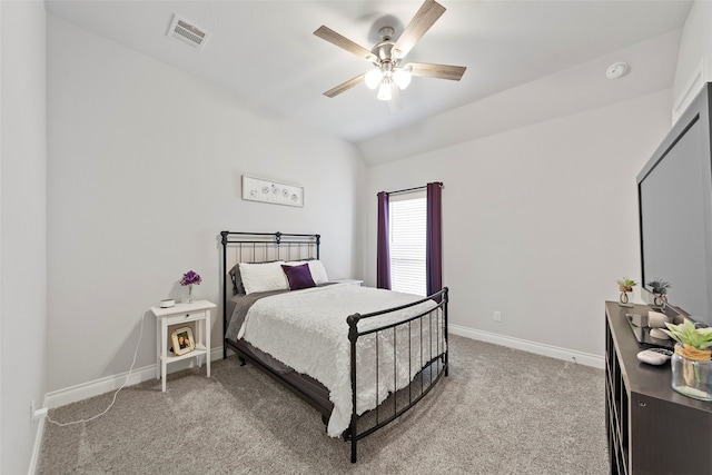 carpeted bedroom with lofted ceiling and ceiling fan