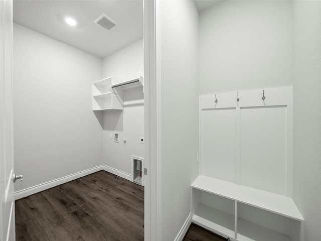 laundry area with electric dryer hookup, visible vents, hookup for a gas dryer, laundry area, and dark wood-style flooring