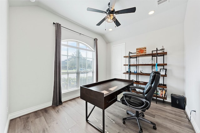 office featuring ceiling fan, vaulted ceiling, and light hardwood / wood-style floors