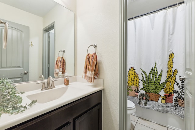 bathroom with tile patterned floors, walk in shower, vanity, and toilet