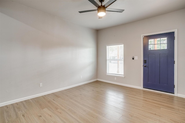 foyer with light wood-type flooring and ceiling fan