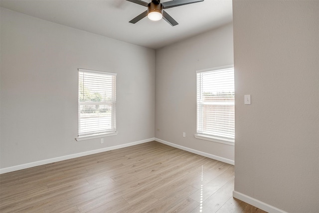 unfurnished room featuring ceiling fan, light hardwood / wood-style flooring, and plenty of natural light