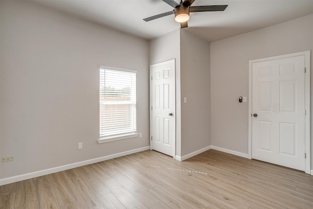 unfurnished bedroom featuring light hardwood / wood-style flooring and ceiling fan